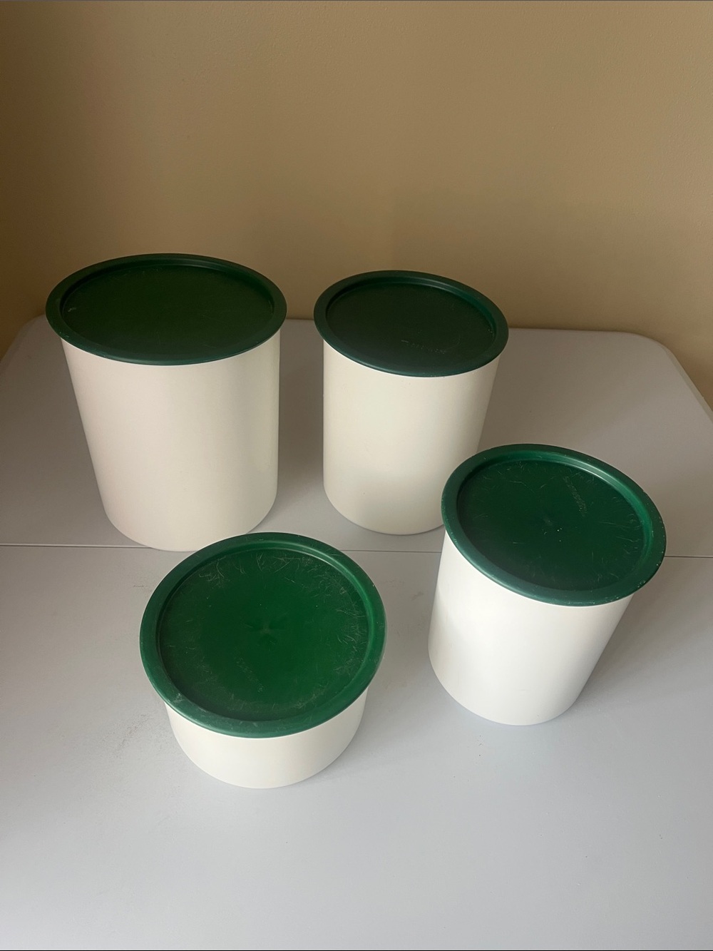 vintage one touch Tupperware Cream Containers with Dark Green Lids set of four